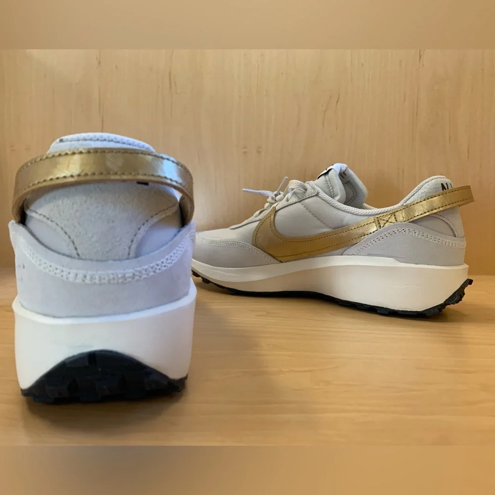 Nike Women's Light Gray Sneakers with Mustard Swoosh